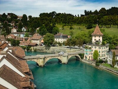 silver-vehicle-on-concrete-arch-bridge-1291766